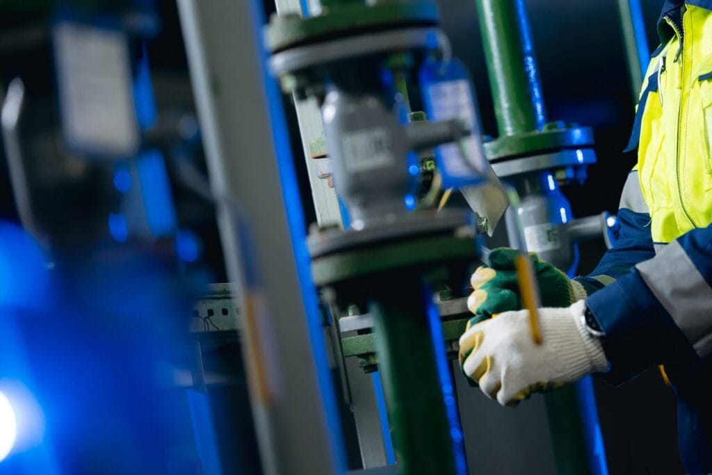 Plumber servicing commercial pipework