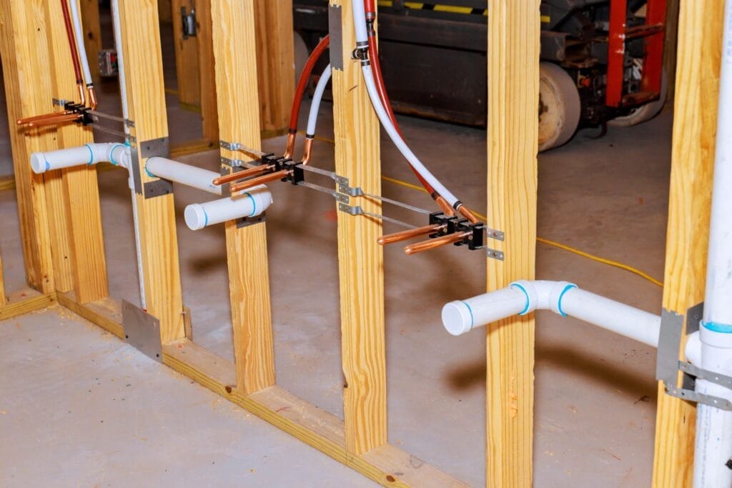 New copper and PEX supply lines installed through wall framing